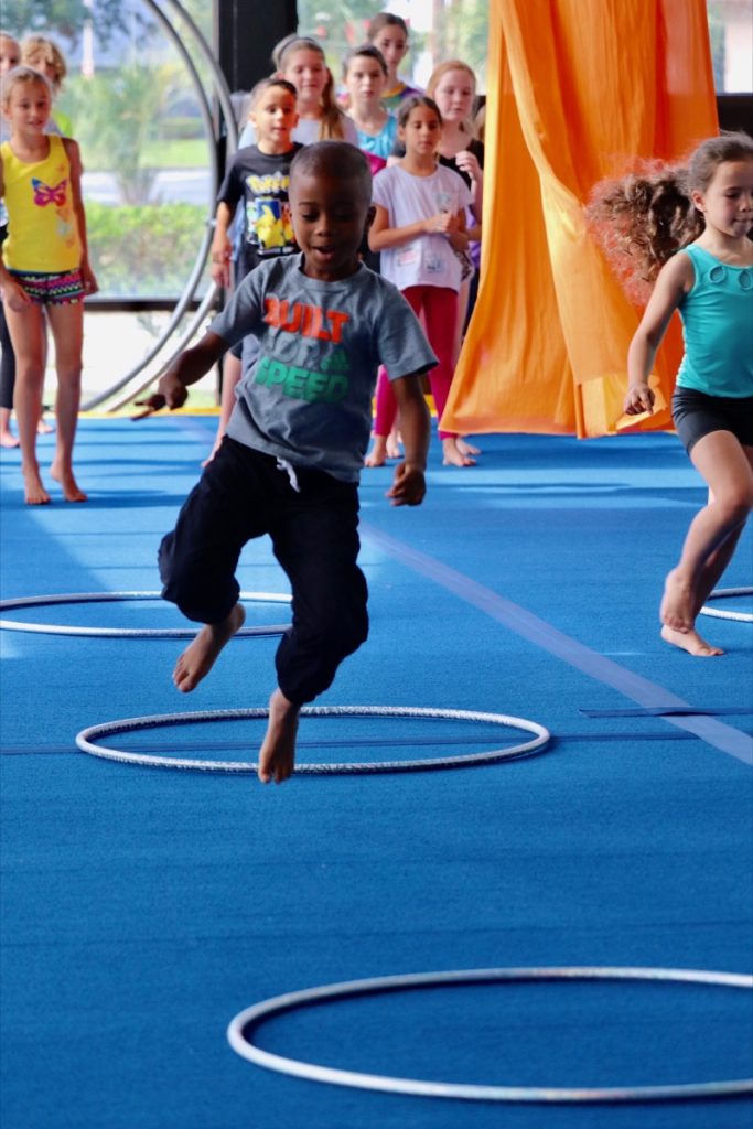 Camper bouncing on the trampoline at circus camp